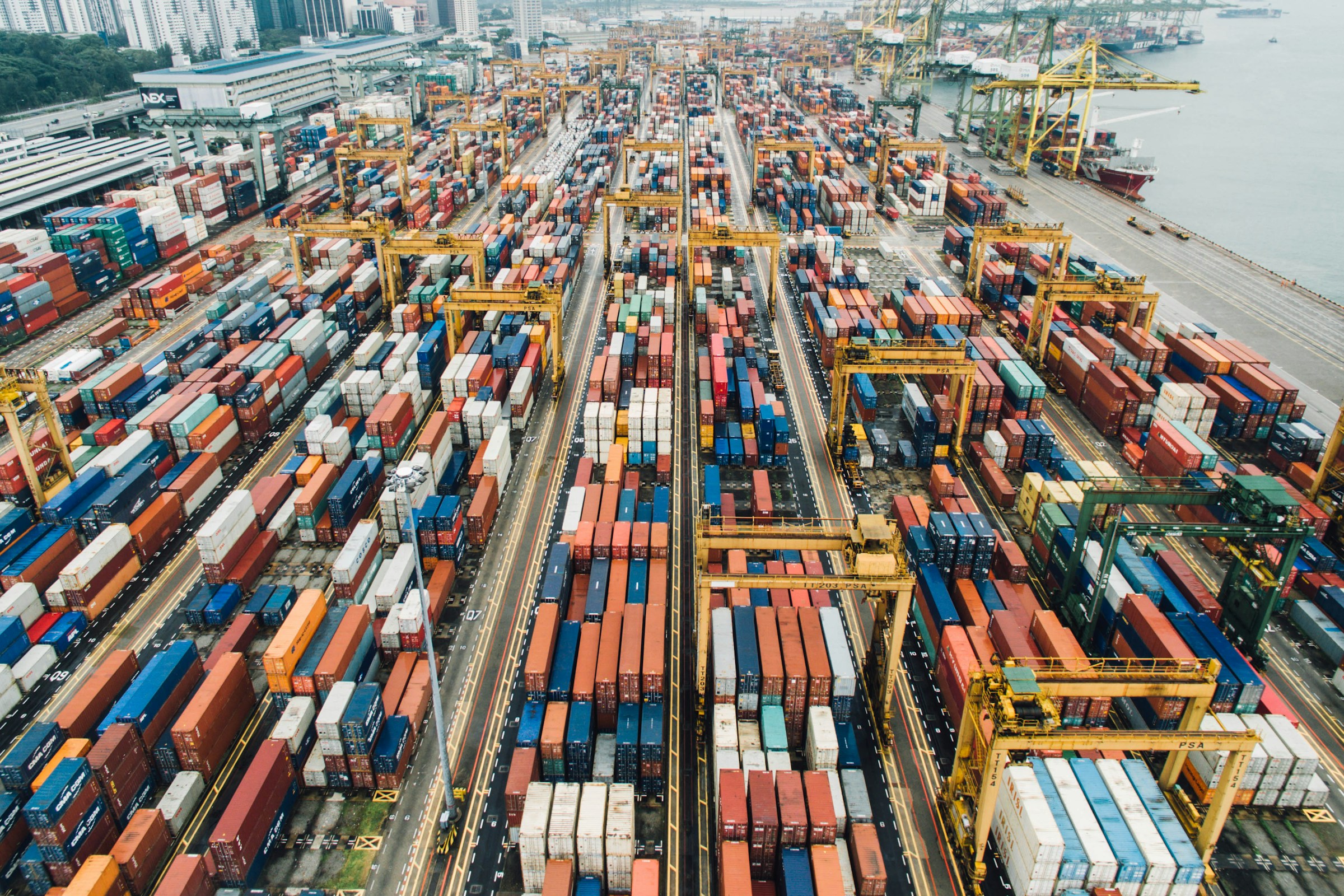 Shipping containers and cranes at an international cargo port